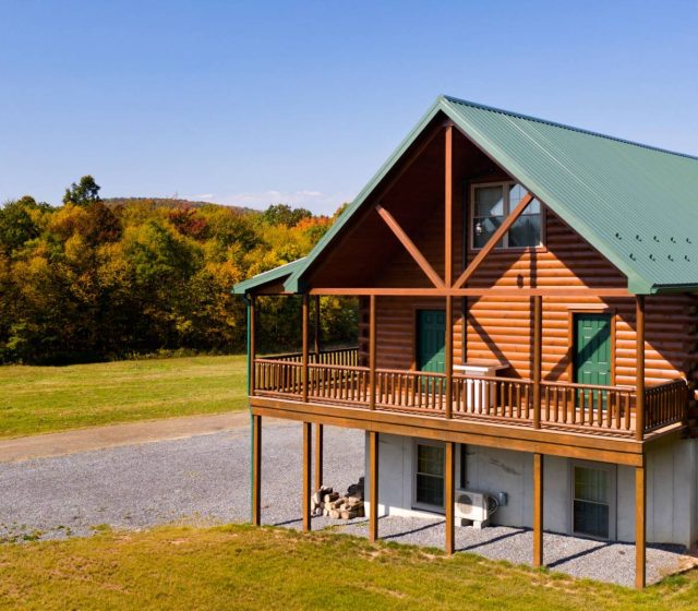 a frame multi story log cabin home